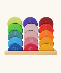 Grimms stacking moon shapes houses. Contains 15 handcrafted wooden crescent shaped blocks with a decorative window and door on the front