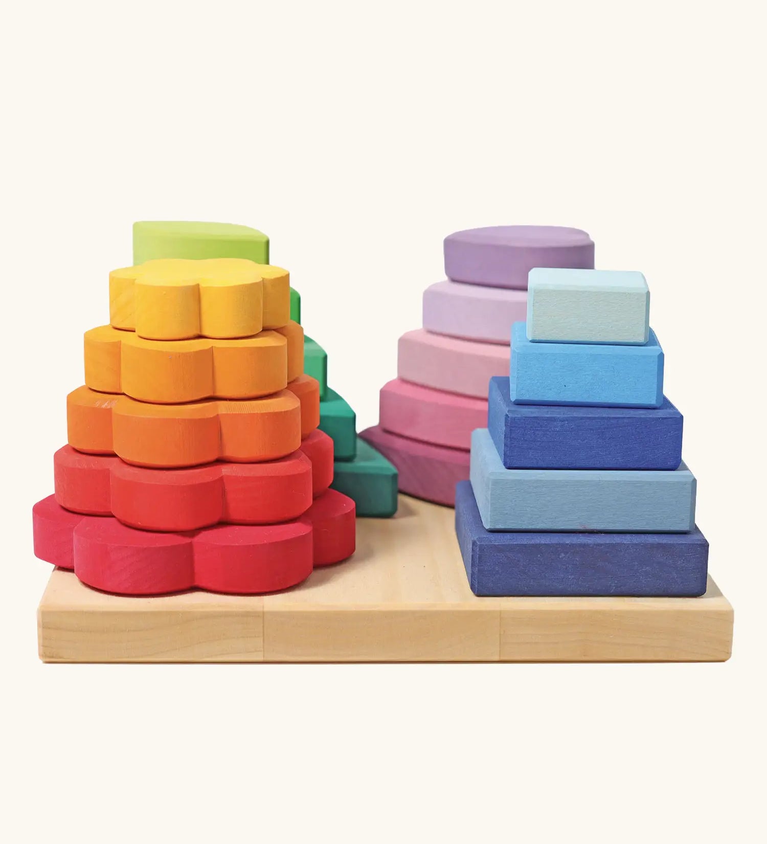 Grimms handcrafted Waldorf stacking tower in various shapes includes 20 wooden pieces hat slot into the pegs.
