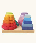 Grimms handcrafted Waldorf stacking tower in various shapes includes 20 wooden pieces hat slot into the pegs.