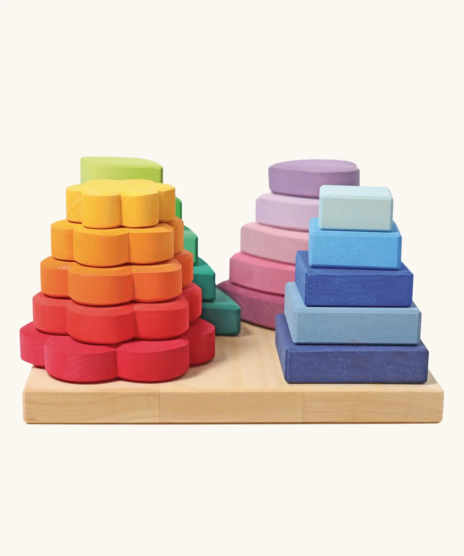 Grimms handcrafted Waldorf stacking tower in various shapes includes 20 wooden pieces hat slot into the pegs.