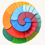 A view from directly above of the Grimm's Counter-Rotating Stepped Spiral wooden block set. 