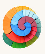 A view from directly above of the Grimm's Counter-Rotating Stepped Spiral wooden block set. 