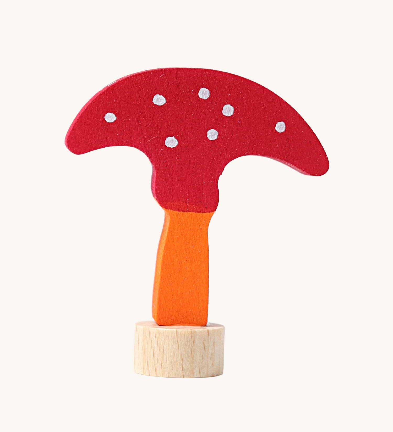 Grimm's decorative toadstool figure for celebration ring. A red coloured top with white dots and an orange coloured stalk.