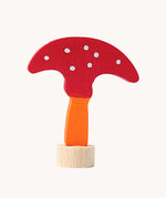 Grimm's decorative toadstool figure for celebration ring. A red coloured top with white dots and an orange coloured stalk.