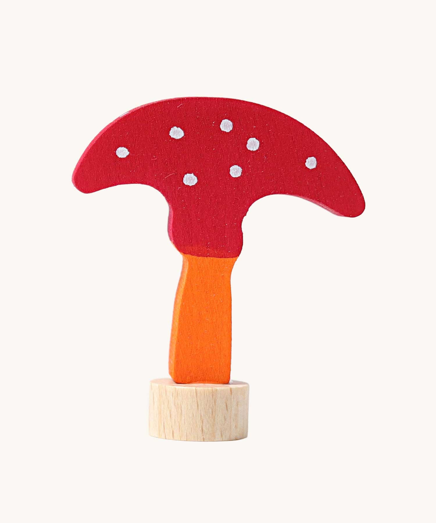 Grimm's decorative toadstool figure for celebration ring. A red coloured top with white dots and an orange coloured stalk.