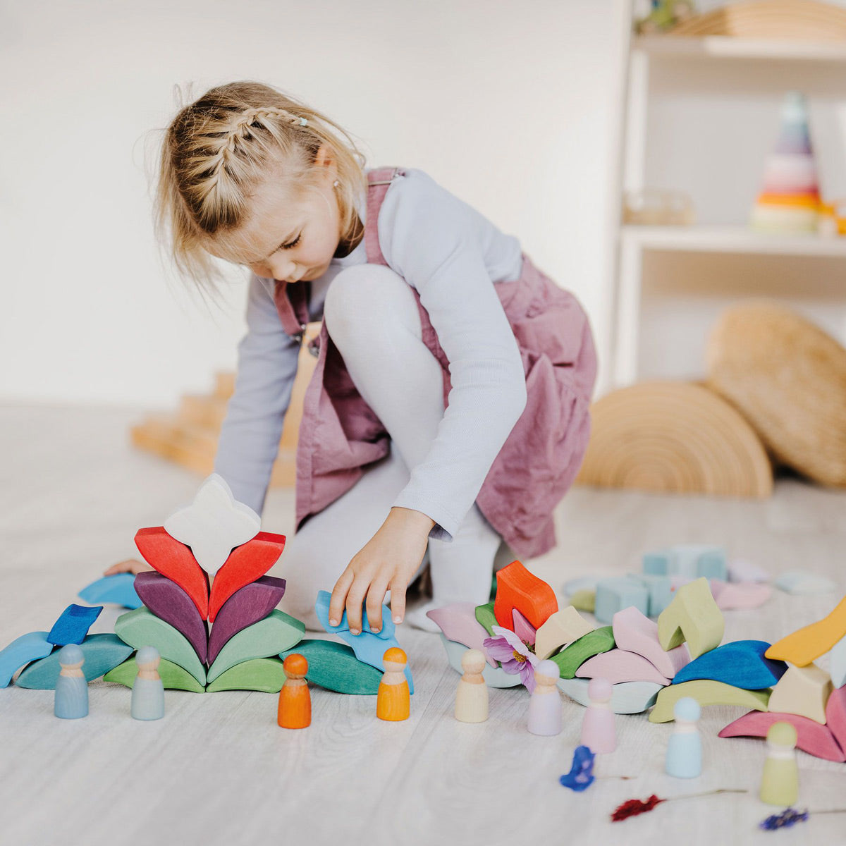 Child playing with the Grimm's Lara Mandala Building Set.