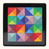 Grimms triangle magnet puzzle set. Includes 64 plywood triangular pieces in bright colours and a storage tin