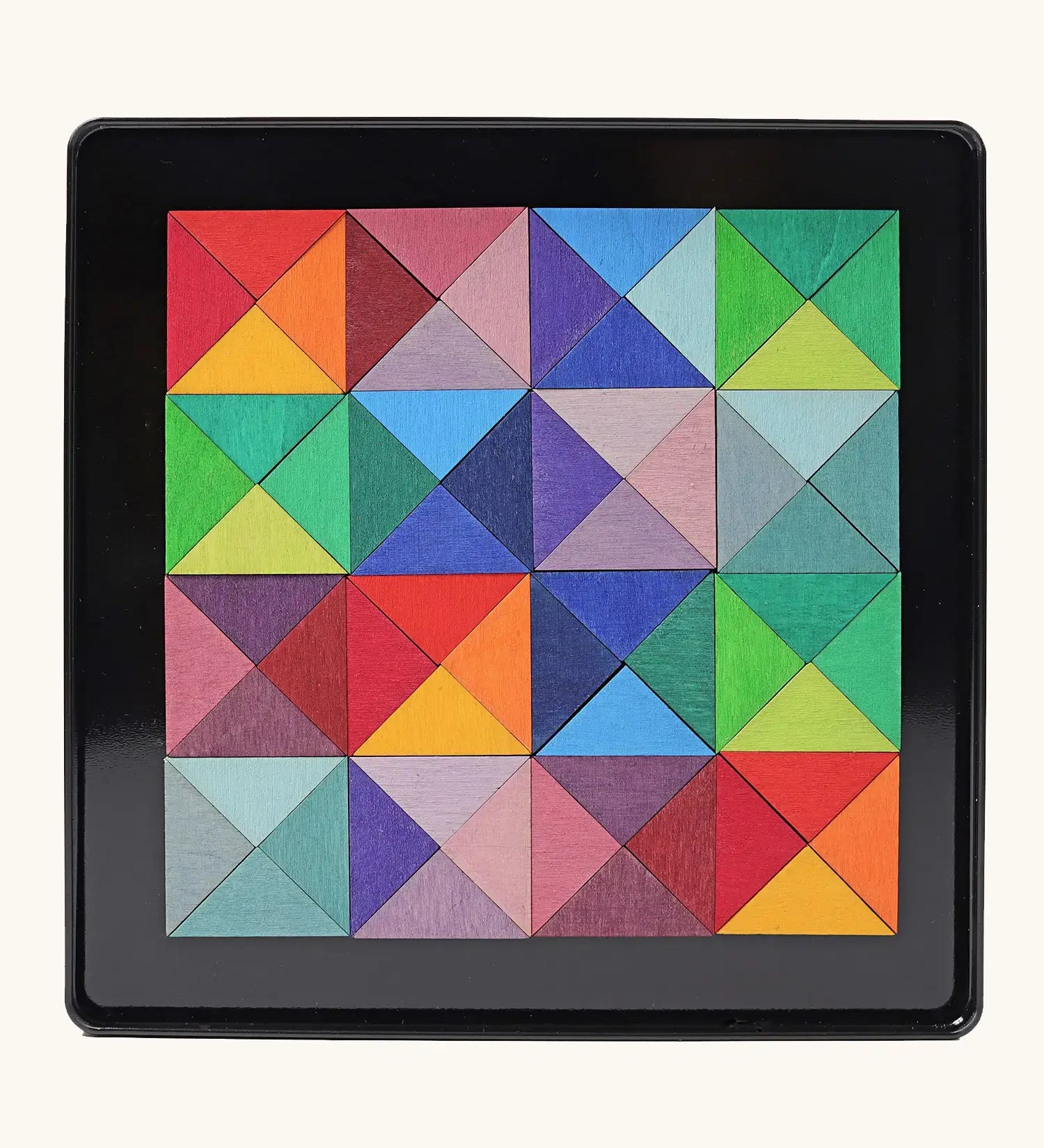 Grimms triangle magnet puzzle set. Includes 64 plywood triangular pieces in bright colours and a storage tin