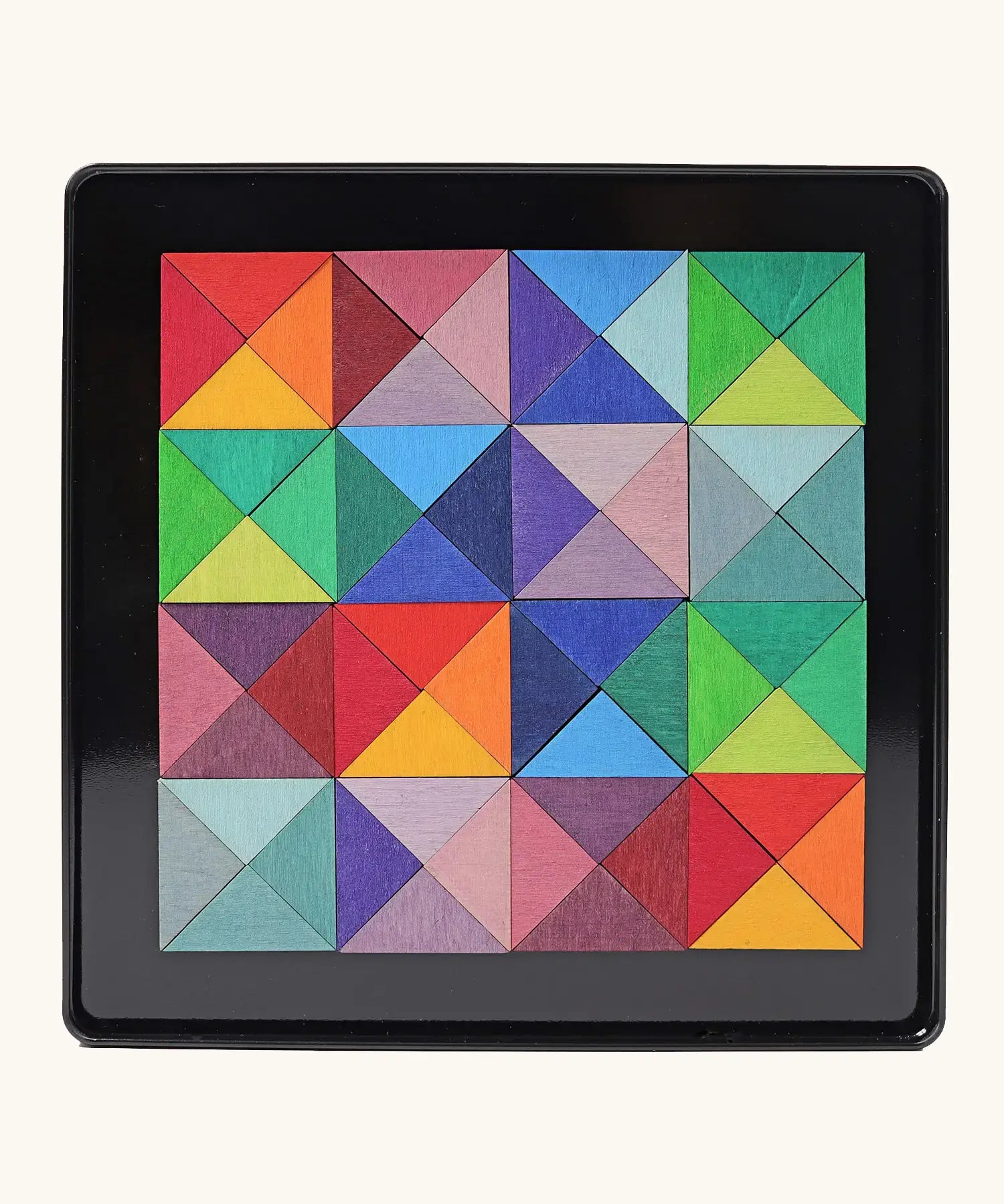 Grimms triangle magnet puzzle set. Includes 64 plywood triangular pieces in bright colours and a storage tin