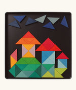 A castle made from the Grimm's bright wooden triangular magnetic pieces displayed in a tin 