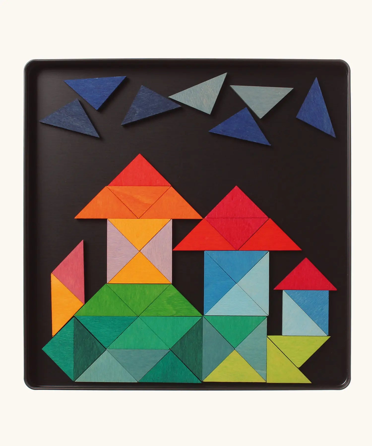 A castle made from the Grimm's bright wooden triangular magnetic pieces displayed in a tin 