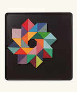 A abstract star shape using the Grimm's bright wooden triangular magnetic pieces displayed in a tin 