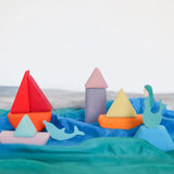 A ocean play scene made from the Grimm's handcrafted wooden triangle, square and circle pieces