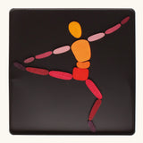 A ballet dancer made from the Grimm's bright wooden two bodies magnetic pieces displayed in a tin 