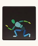 A person crouched made from the Grimm's bright wooden two bodies magnetic pieces displayed in a tin 