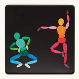Two dancers made from the Grimm's bright wooden two bodies magnetic pieces displayed in a tin 