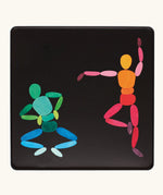 Two dancers made from the Grimm's bright wooden two bodies magnetic pieces displayed in a tin 