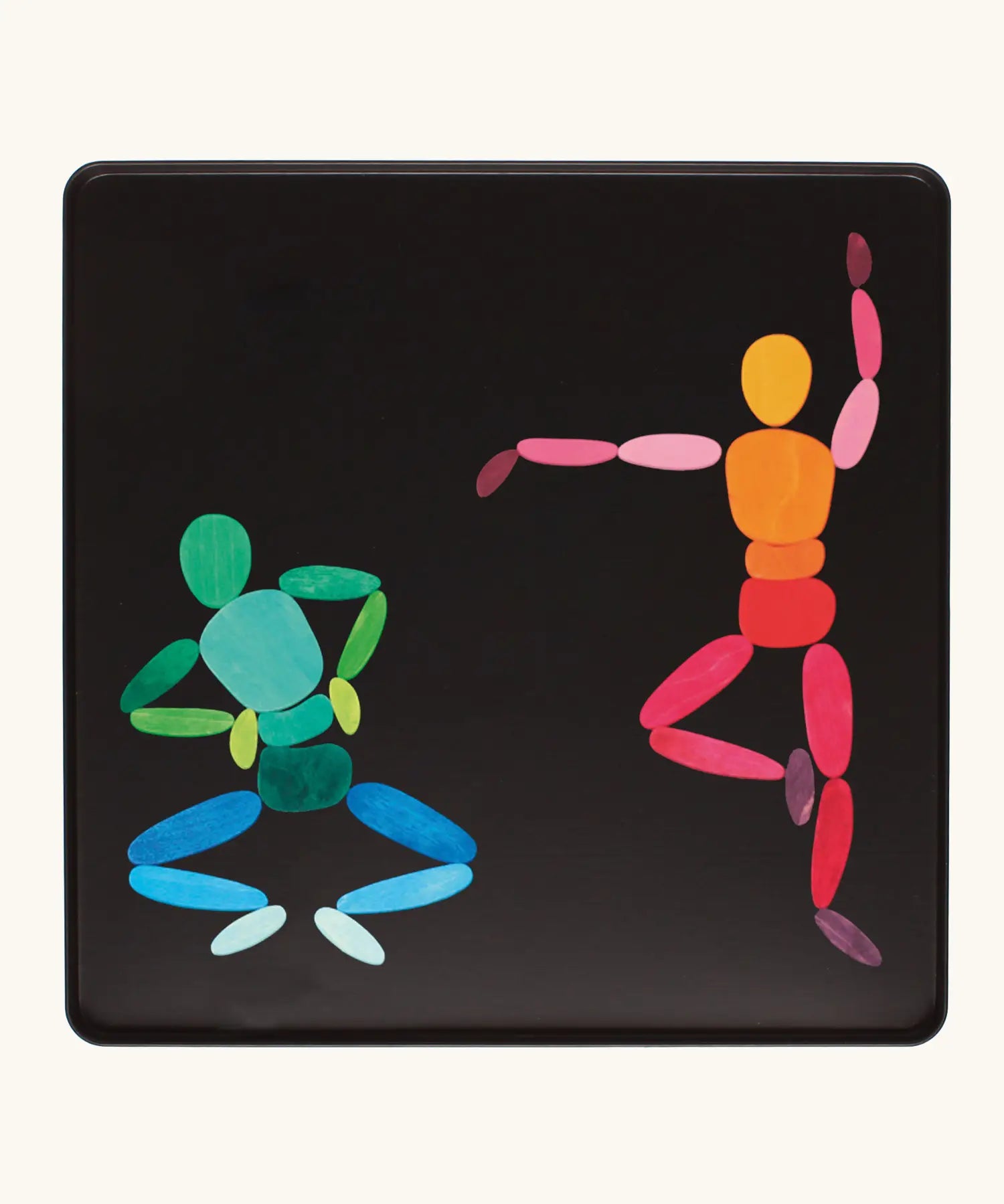 Two dancers made from the Grimm's bright wooden two bodies magnetic pieces displayed in a tin 