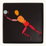 A goalkeeper made from the Grimm's bright wooden two bodies magnetic pieces displayed in a tin 