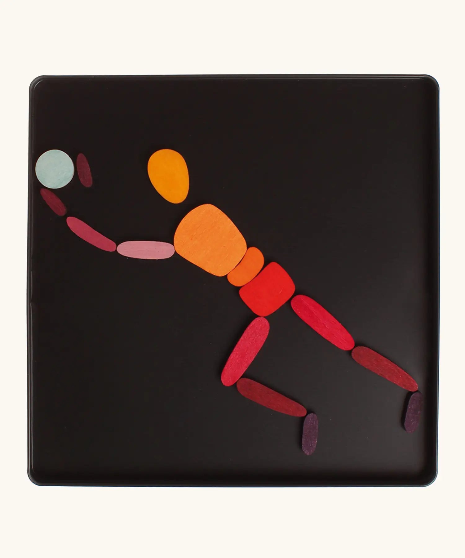 A goalkeeper made from the Grimm's bright wooden two bodies magnetic pieces displayed in a tin 