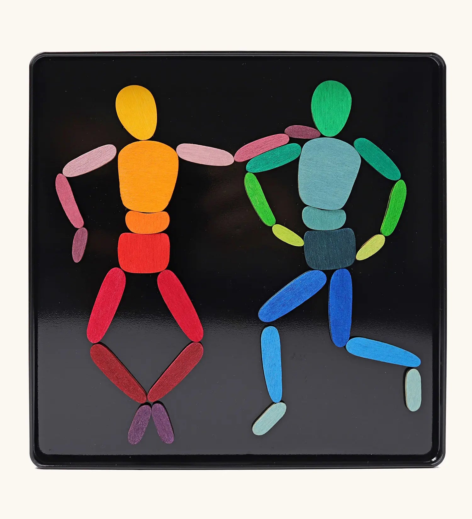 Grimms two bodies magnet puzzle set. Includes 32 plywood magnetic pieces in bright colours and a storage tin