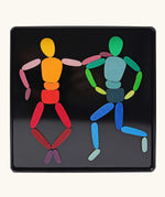 Grimms two bodies magnet puzzle set. Includes 32 plywood magnetic pieces in bright colours and a storage tin