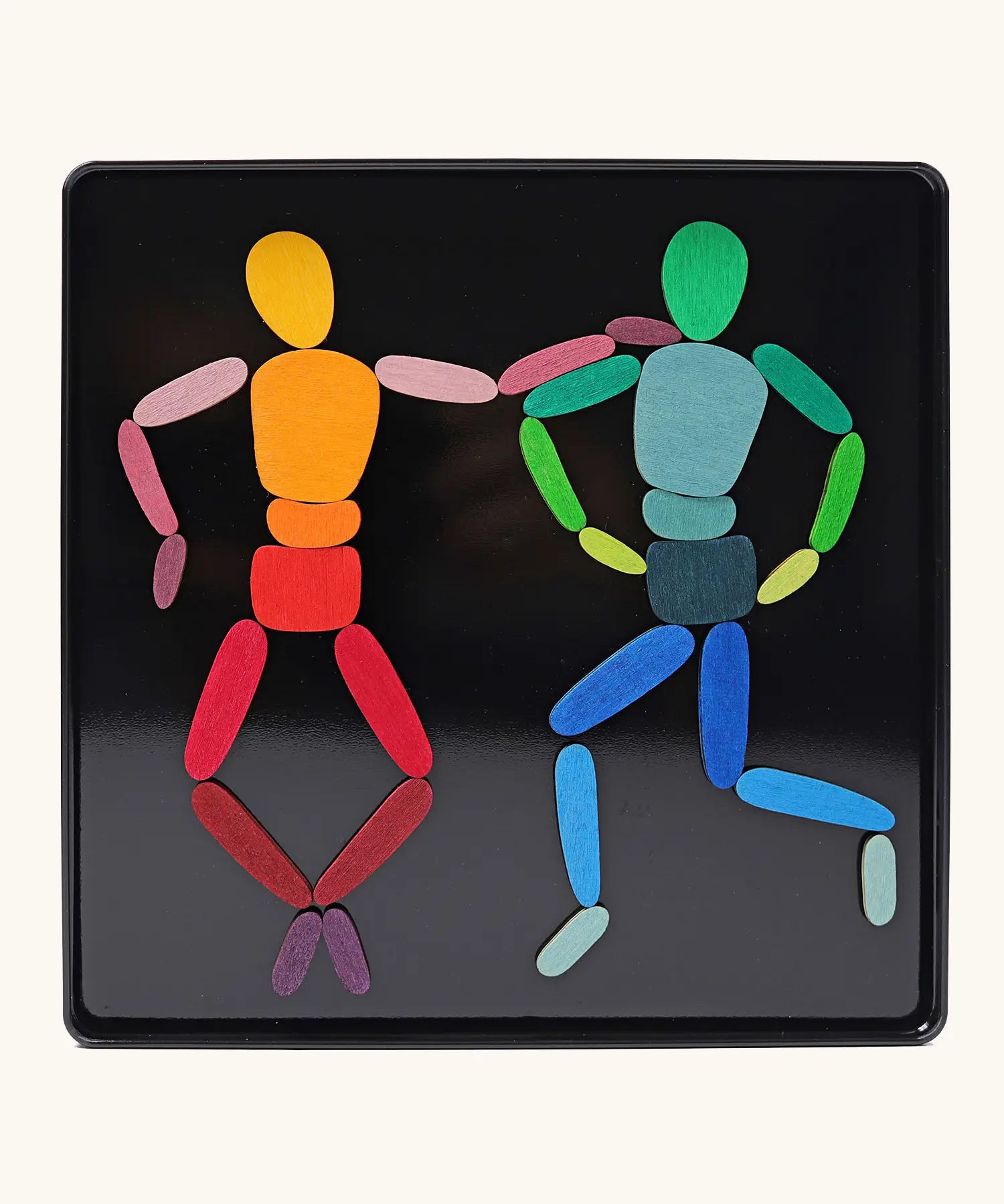 Grimms two bodies magnet puzzle set. Includes 32 plywood magnetic pieces in bright colours and a storage tin