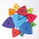 Overhead view of loose wooden triangular pieces and base from the Grimms wankel tower