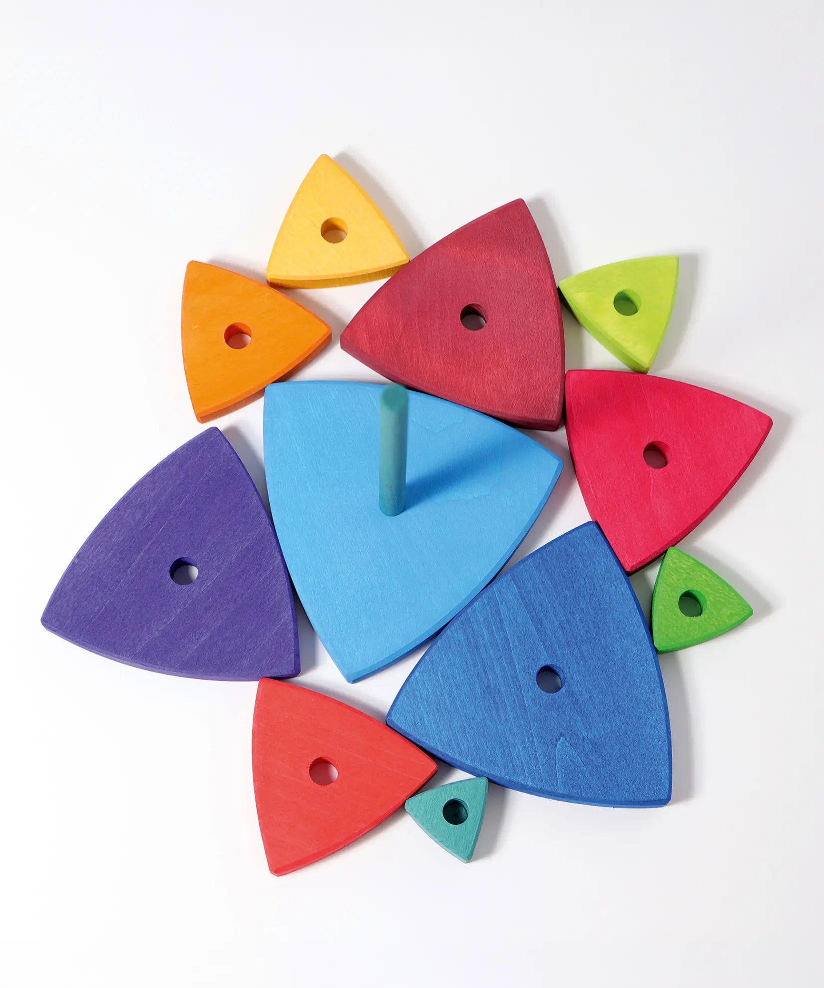 Overhead view of loose wooden triangular pieces and base from the Grimms wankel tower