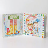 An open Grimms weather book showing watercolour style illustrations 