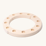 Grimm's White 12-Hole Celebration Ring on a plain background. 