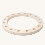 Grimm's 16-Hole White Celebration Ring on a plain background. 