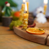 A cosy and warm display using a Grimm's Waldorf Celebration Ring and Grimm's Grimm's Candle savailable at Babipur