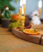 A cosy and warm display using a Grimm's Waldorf Celebration Ring and Grimm's Grimm's Candle savailable at Babipur