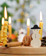 A lovely Winter display using a Grimm's Waldorf Celebration Ring, Grimm's decorative figures and Grimm's Candles available at Babipur.