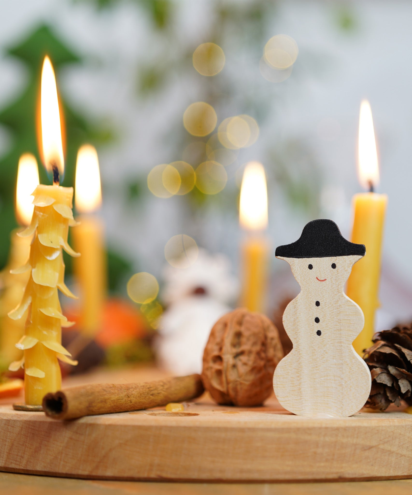 A lovely Winter display using a Grimm's Waldorf Celebration Ring, Grimm's decorative figures and Grimm's Candles available at Babipur.