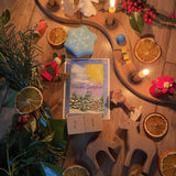 A top down photo of a beautiful Winter Solstice display using the Grimms wooden celebration ring, various Winter Grimms decorative figures, Grimms candles and other wooden figures available at Babipur.