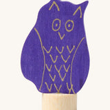 Grimms wooden blue owl figure with a hand painted finish with gold features standing on a small base stand to slot in a celebration ring