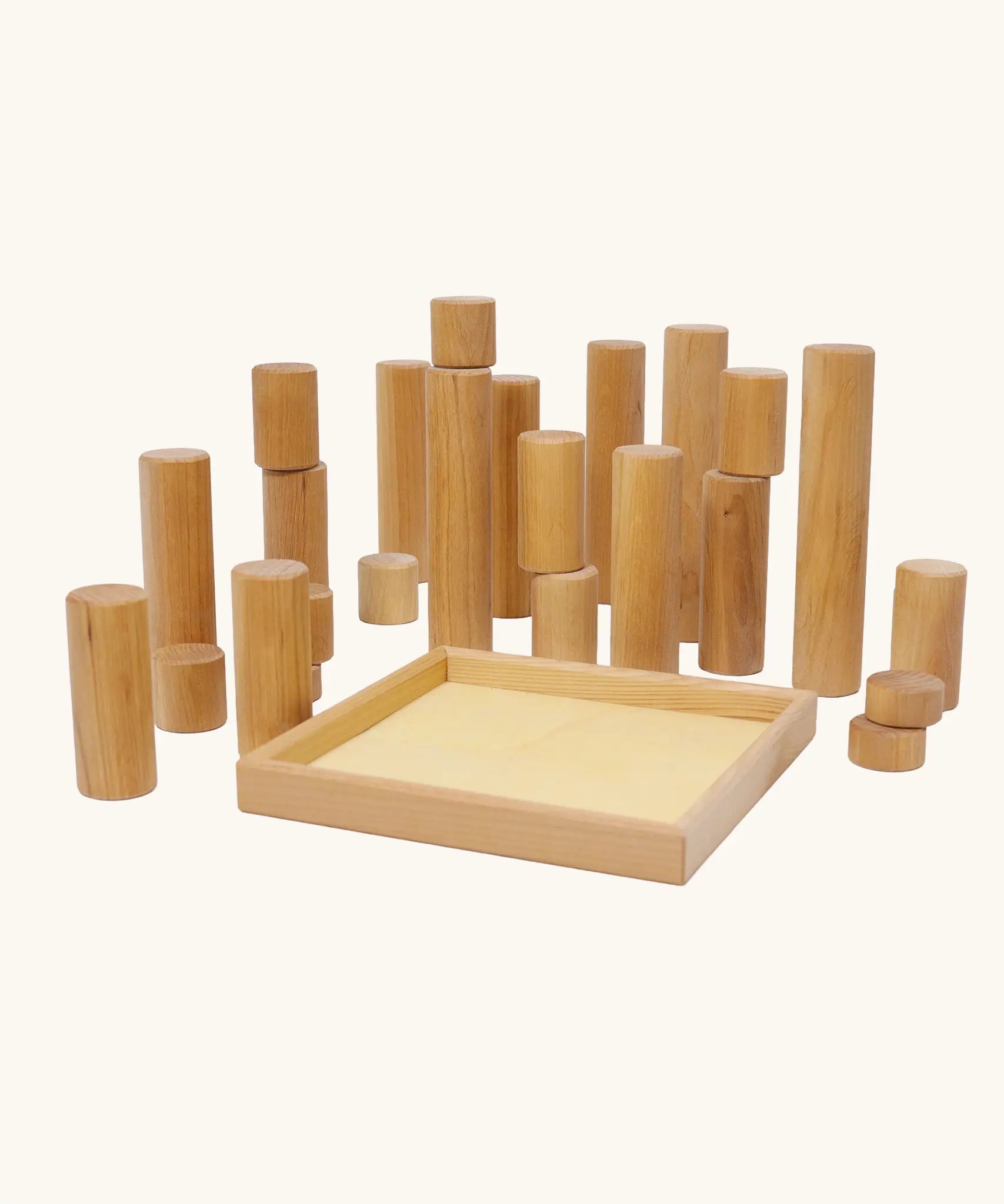 Grimm's large wooden building rollers in natural next to the tray.