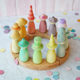 A pretty pastel coloured display using a Grimm's Waldorf Celebration Ring, various Grapat nin figures and Grimms confetti pieces available at Babipur.