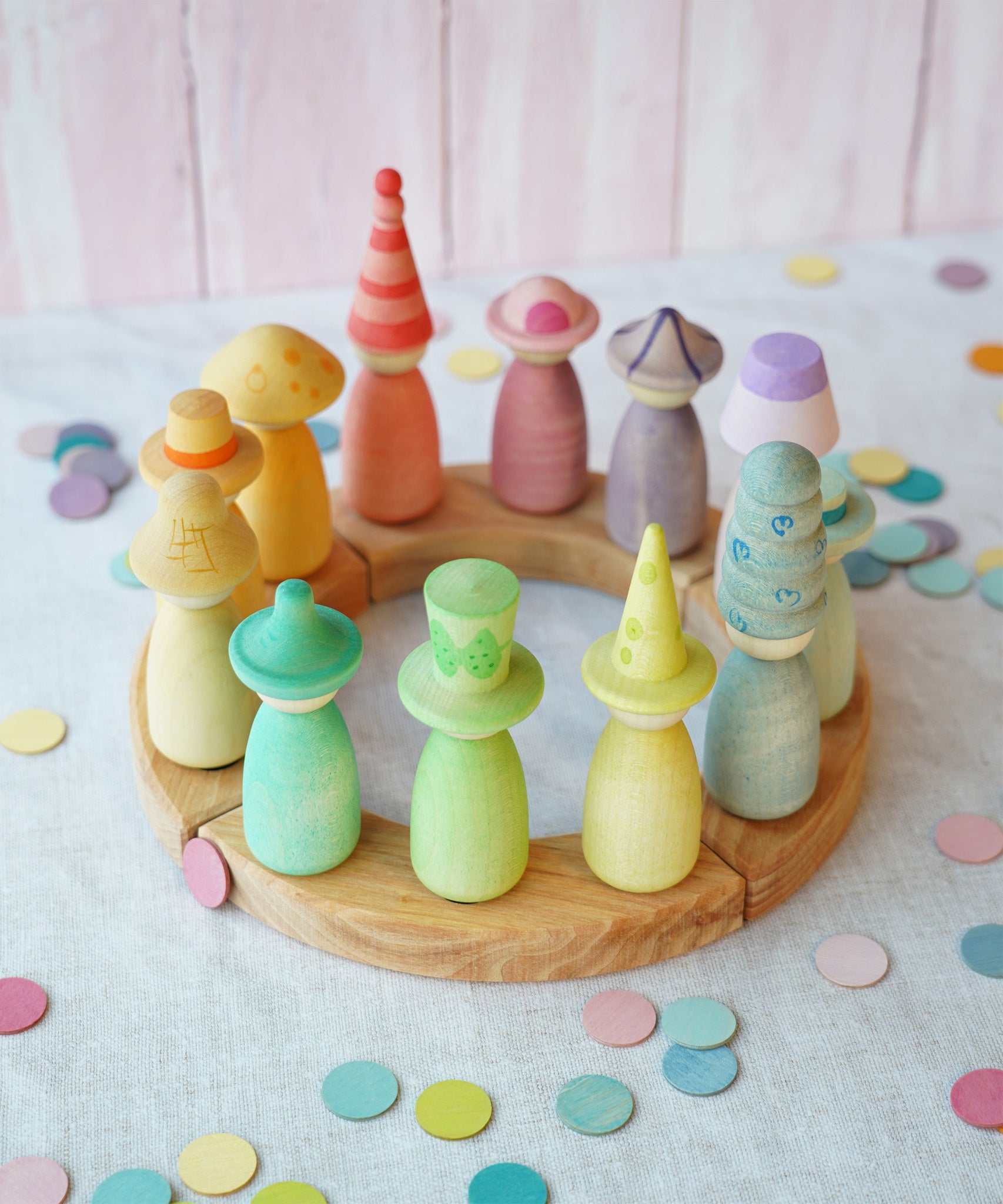 A pretty pastel coloured display using a Grimm's Waldorf Celebration Ring, various Grapat nin figures and Grimms confetti pieces available at Babipur.