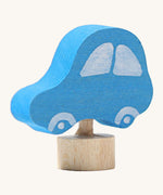 Side view of the Grimms wooden blue car decorative figure. Showing the thickness of the figure and paint detail 