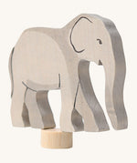 A close up of the Grimms wooden elephant decorative figure showing the hand painted facial features. 