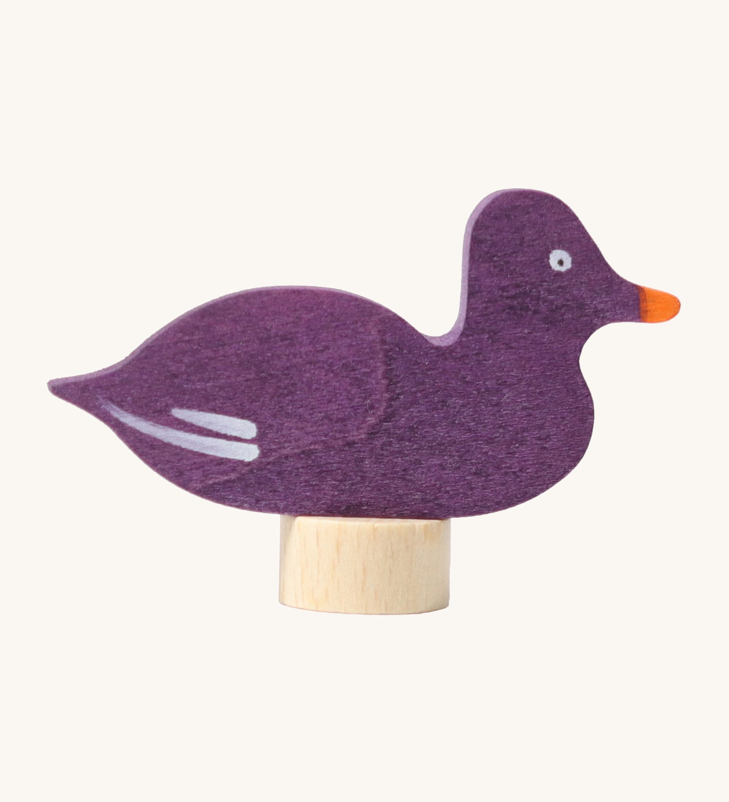 Grimms wooden sitting purple duck decorative figure with a hand painted finish. Features a small base stand on the bottom to slot in a celebration ring