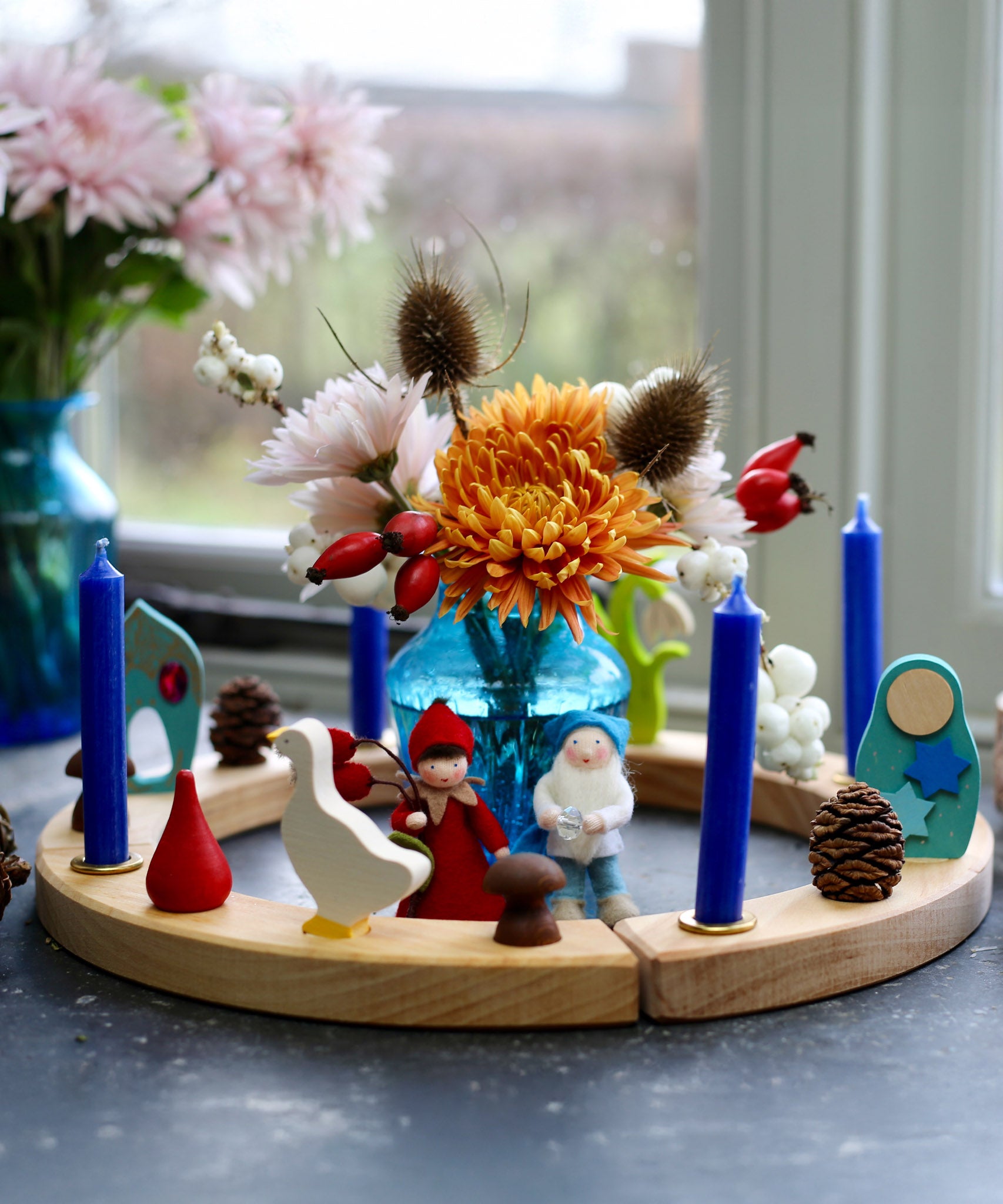 A Winter inspired display using a Grimm's Waldorf Celebration Ring, Grimm's decorative figures, Grimm's Candles and Ambrosius dolls available at Babipur
