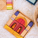 Overhead view of a Grimms wooden desert sand set on a fluffy rug