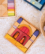 Overhead view of a Grimms wooden desert sand set on a fluffy rug