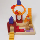 A house structure made from the wooden blocks from the Grimms desert sand set standing in the frame