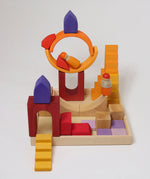 A house structure made from the wooden blocks from the Grimms desert sand set standing in the frame