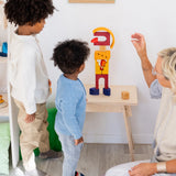 Family building a abstract person made from the Grimms desert sand wooden block set